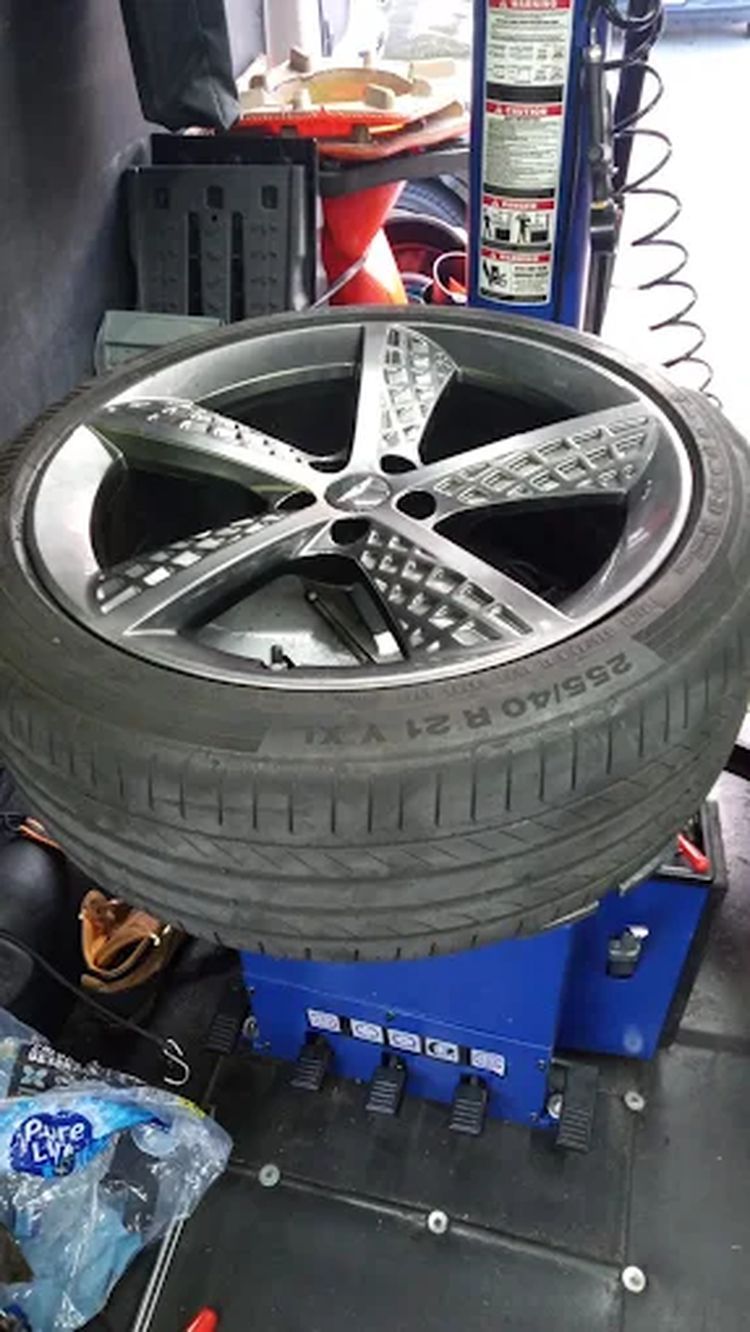 Alloy wheel mounted on a wheel balancing machine